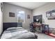 Bedroom featuring a bed, window for natural light, and desk area at 12105 W Wier Ave, Avondale, AZ 85323