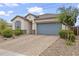 Inviting exterior of a single-Gathering home with a stone driveway and desert landscaping at 12105 W Wier Ave, Avondale, AZ 85323