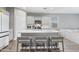 Stylish kitchen island with seating, stainless steel appliances, and an open floor plan at 12105 W Wier Ave, Avondale, AZ 85323