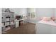 Cozy bedroom with shelves, a bed, and a desk for a perfect study or relax at 12834 W Forest Pleasant Pl, Peoria, AZ 85383
