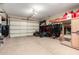 Spacious garage featuring overhead lighting, storage for bikes, an ATV, and a Sunlighten sauna at 12834 W Forest Pleasant Pl, Peoria, AZ 85383