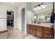 Elegant bathroom featuring a vanity with drawers, and an entrance to the walk-in closet at 12834 W Forest Pleasant Pl, Peoria, AZ 85383