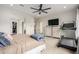 Spacious main bedroom featuring a ceiling fan, walk-in closet, and carpeted floor at 12834 W Forest Pleasant Pl, Peoria, AZ 85383