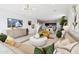Stylish living room featuring a white shiplap wall, comfortable seating, and an adjacent kitchen area at 1300 W Bealey Ave, Coolidge, AZ 85128