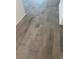 Stylish gray tile flooring with a wood-look pattern, adding a touch of modern elegance to the home's interior at 1300 W Bealey Ave, Coolidge, AZ 85128