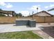 Outdoor kitchen featuring a built in barbeque, a concrete patio, and a green lawn at 1408 N 62Nd Pl, Mesa, AZ 85205