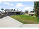 Large backyard featuring lush lawn, built-in BBQ area, and mature landscaping at 1408 N 62Nd Pl, Mesa, AZ 85205