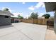 Wide-angle view of spacious backyard patio with block fencing and access gates at 1408 N 62Nd Pl, Mesa, AZ 85205