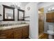 Updated bathroom with double vanity, granite counters, and shower at 1408 N 62Nd Pl, Mesa, AZ 85205