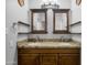Updated bathroom with granite counters, framed mirrors and double vanity at 1408 N 62Nd Pl, Mesa, AZ 85205
