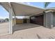 View of spacious carport with attached garage and side gate for access to backyard at 1408 N 62Nd Pl, Mesa, AZ 85205