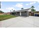 The backyard features a long driveway and a large backyard at 1408 N 62Nd Pl, Mesa, AZ 85205