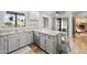 Updated kitchen features a breakfast bar, granite countertops, and backyard views at 1408 N 62Nd Pl, Mesa, AZ 85205