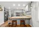 The updated kitchen offers granite counters, stainless steel appliances, and room to gather at 1408 N 62Nd Pl, Mesa, AZ 85205