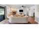 Comfortable living room featuring a fireplace and sliding doors to the backyard at 1408 N 62Nd Pl, Mesa, AZ 85205
