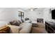 Cozy living room with a comfortable sectional couch and neutral decor at 1408 N 62Nd Pl, Mesa, AZ 85205