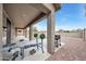 Covered patio with outdoor weights, grill, string lights, and view of the lawn at 16039 W Pima St, Goodyear, AZ 85338