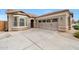 Charming home featuring a well-manicured lawn, neutral stucco and stone accents at 16039 W Pima St, Goodyear, AZ 85338