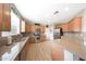 Well-equipped kitchen with stainless steel appliances, granite countertops, and ample cabinet space at 16039 W Pima St, Goodyear, AZ 85338