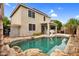 Inviting backyard showcasing a pool, patio, and well-maintained landscaping, perfect for outdoor living at 16139 N 171St Ln, Surprise, AZ 85388