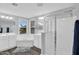 Bathroom features a tub, shower with glass doors, and dual sinks at 16139 N 171St Ln, Surprise, AZ 85388
