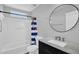 Bathroom featuring modern vanity, mirror and tub at 16139 N 171St Ln, Surprise, AZ 85388