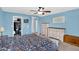 Bedroom featuring a closet, blue walls, ceiling fan and dressers at 16139 N 171St Ln, Surprise, AZ 85388