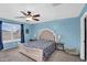 Bedroom featuring a large window, ceiling fan, and plush carpet at 16139 N 171St Ln, Surprise, AZ 85388