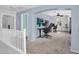 Spacious loft/bedroom with arched entryways, ceiling fan, neutral paint, and plush carpeting at 16139 N 171St Ln, Surprise, AZ 85388