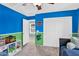 Cheerful bedroom featuring blue and green walls, white closets and a blue and green carpet at 16139 N 171St Ln, Surprise, AZ 85388