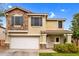 Charming two-story home with stone accents and a well-manicured front yard at 16139 N 171St Ln, Surprise, AZ 85388