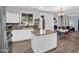Bright open kitchen with granite countertops and stainless appliances, adjacent to casual dining and living areas at 16139 N 171St Ln, Surprise, AZ 85388