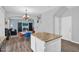 Bright open-concept kitchen with granite island, overlooking the living and dining areas, perfect for entertaining at 16139 N 171St Ln, Surprise, AZ 85388