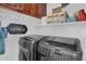Well-organized laundry room featuring modern washer and dryer units and ample storage space at 16139 N 171St Ln, Surprise, AZ 85388