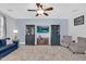 Spacious living room features modern furniture, plush carpet, and large television at 16139 N 171St Ln, Surprise, AZ 85388