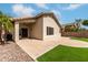 Expansive backyard showcasing a well-maintained lawn, extended patio, and mature landscaping at 16424 S 46Th Way, Phoenix, AZ 85048