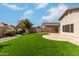 Picture of backyard with lush turf, desert landscaping, and covered patio, perfect for outdoor living at 16424 S 46Th Way, Phoenix, AZ 85048