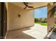Enjoy the backyard from the covered patio with a ceiling fan and outdoor lighting at 16424 S 46Th Way, Phoenix, AZ 85048