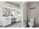 Charming bathroom highlighting a double vanity and toilet with white tile flooring at 16424 S 46Th Way, Phoenix, AZ 85048