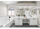 Well-lit bathroom showcasing a soaking tub and double vanity with a large mirror at 16424 S 46Th Way, Phoenix, AZ 85048