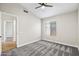 Comfortable bedroom with a ceiling fan, neutral color scheme, and plush carpeting at 16424 S 46Th Way, Phoenix, AZ 85048
