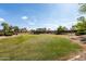 Expansive community park with lush green spaces, walking paths, and a playground at 16424 S 46Th Way, Phoenix, AZ 85048