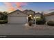 Charming single-story home with a two-car garage, neutral palette, and desert landscaping, set against a colorful sunset sky at 16424 S 46Th Way, Phoenix, AZ 85048