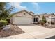 Single-story home with a two-car garage, xeriscaped front yard, and mature landscaping, perfect for low-maintenance living at 16424 S 46Th Way, Phoenix, AZ 85048