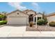 Inviting single-story home featuring a two-car garage, neutral paint, and xeriscaped front yard under a bright blue sky at 16424 S 46Th Way, Phoenix, AZ 85048
