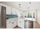 Bright kitchen featuring quartz countertops, stainless appliances, and eat-in breakfast nook at 16424 S 46Th Way, Phoenix, AZ 85048