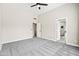 Bright main bedroom with plush gray carpet, vaulted ceiling, and ensuite bathroom access at 16424 S 46Th Way, Phoenix, AZ 85048
