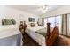 Bright bedroom with a plush bed, neutral decor and carpeted flooring at 17200 W Bell Rd # 1015, Surprise, AZ 85374