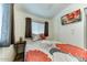 Cozy bedroom with built in shelving, a TV and a double window at 17200 W Bell Rd # 1015, Surprise, AZ 85374