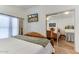 Bedroom featuring carpeted floors, mirrored closet, and neutral decor at 17200 W Bell Rd # 1015, Surprise, AZ 85374
